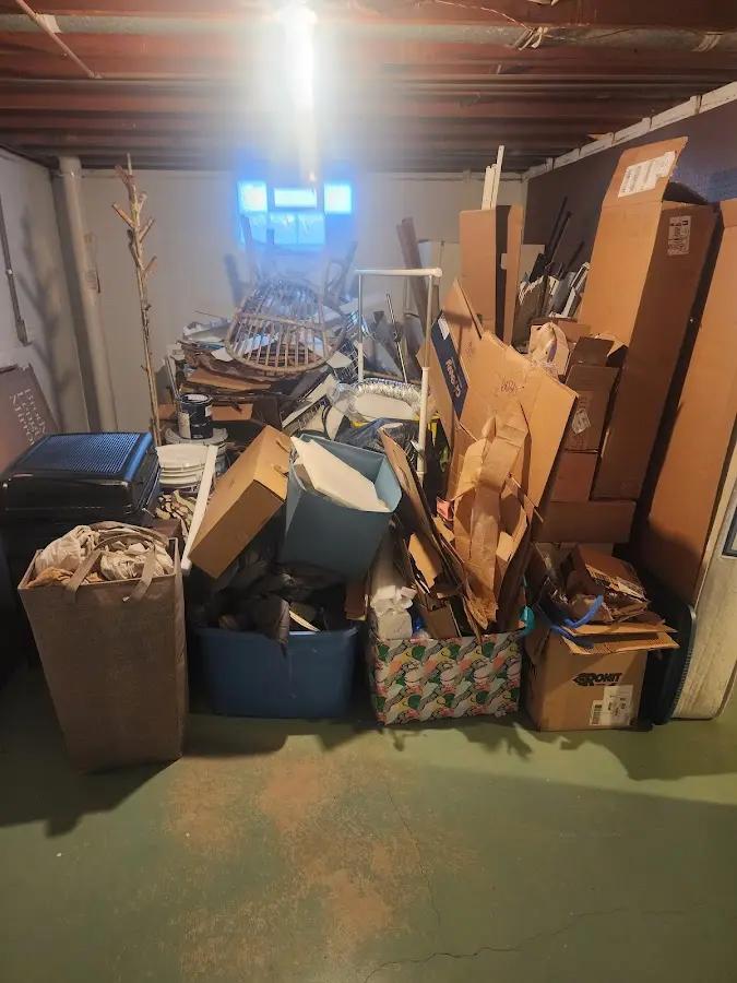 Roll-off dumpster container at job site for Yard Waste Dumpster Rental in Monmouth